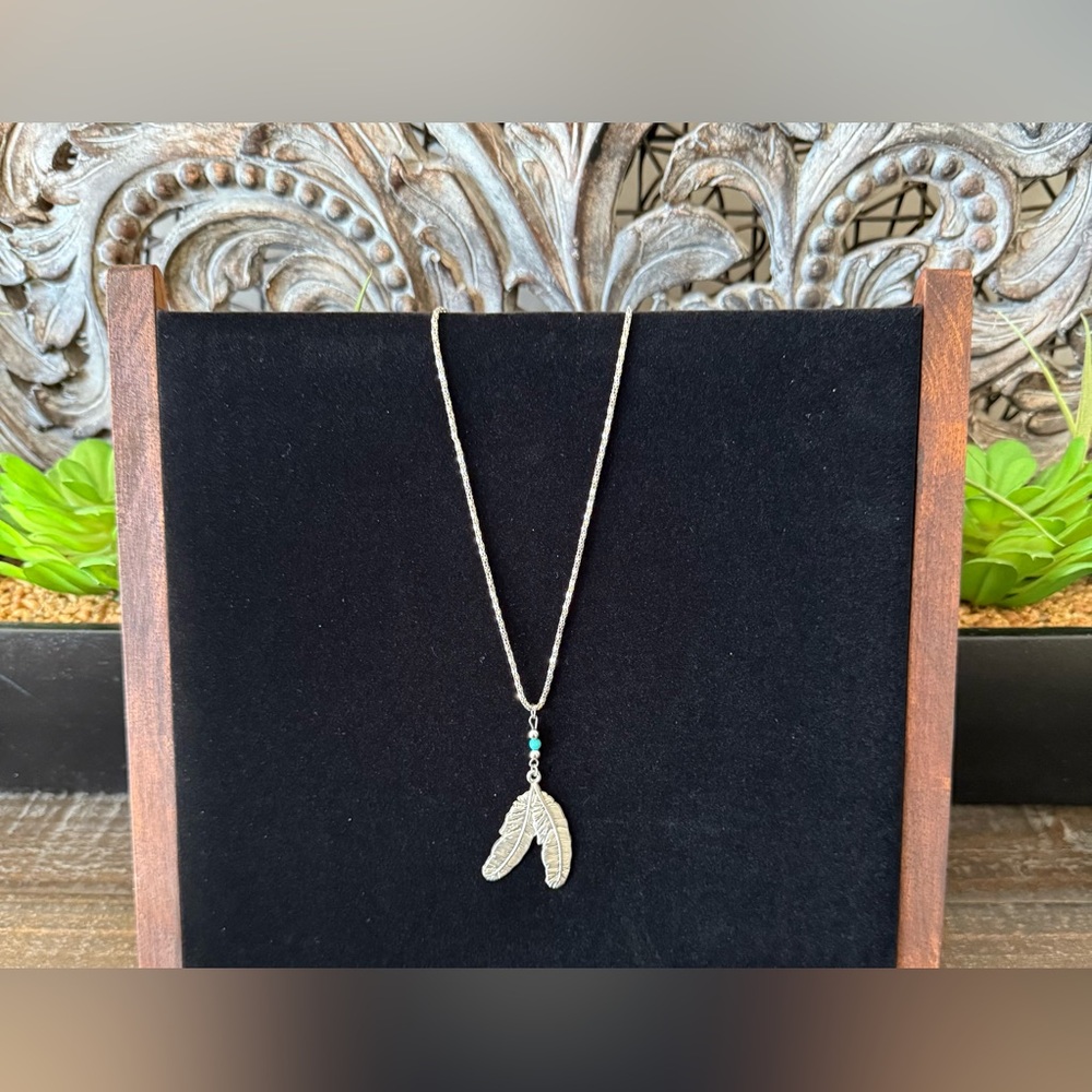 Tribal Feathers silver toned necklace.